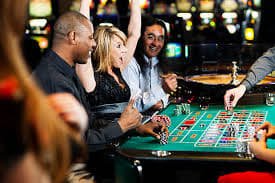 Live poker table with professional dealers and multi-camera setup at nomor sidney